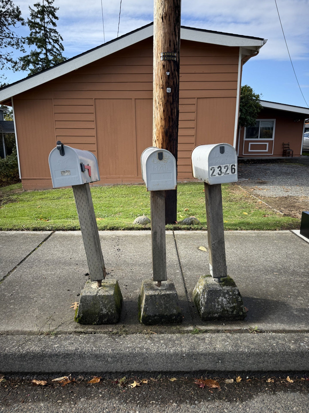 Replacing a Leaning Rental Property Mailbox With a Surface-Mounted Locking Mailbox