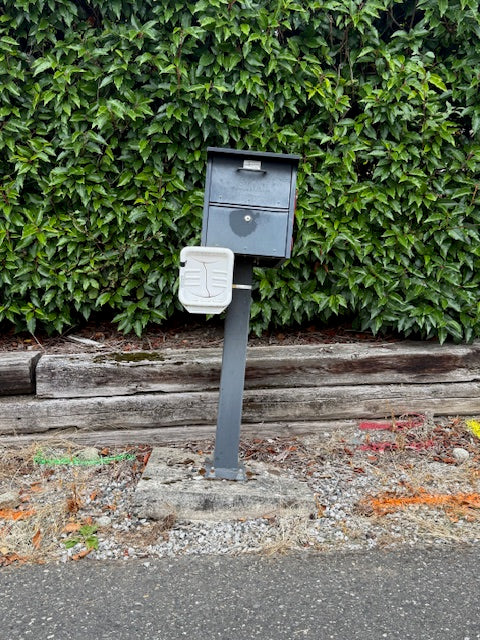 Replacing a Leaning Mailbox After Vehicle Damage With a New Locking Mailbox Installation